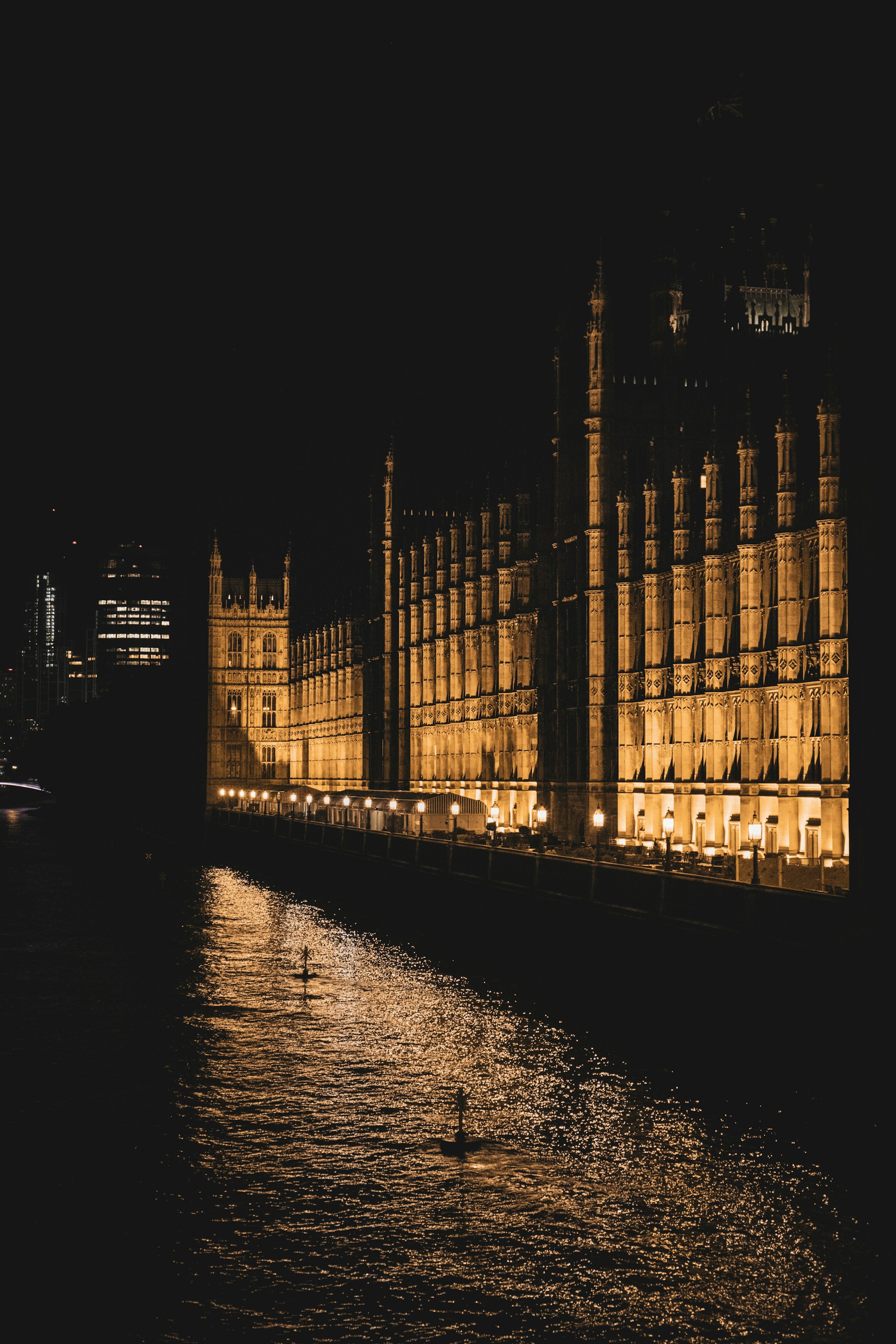 London at night with city lights and historic architecture