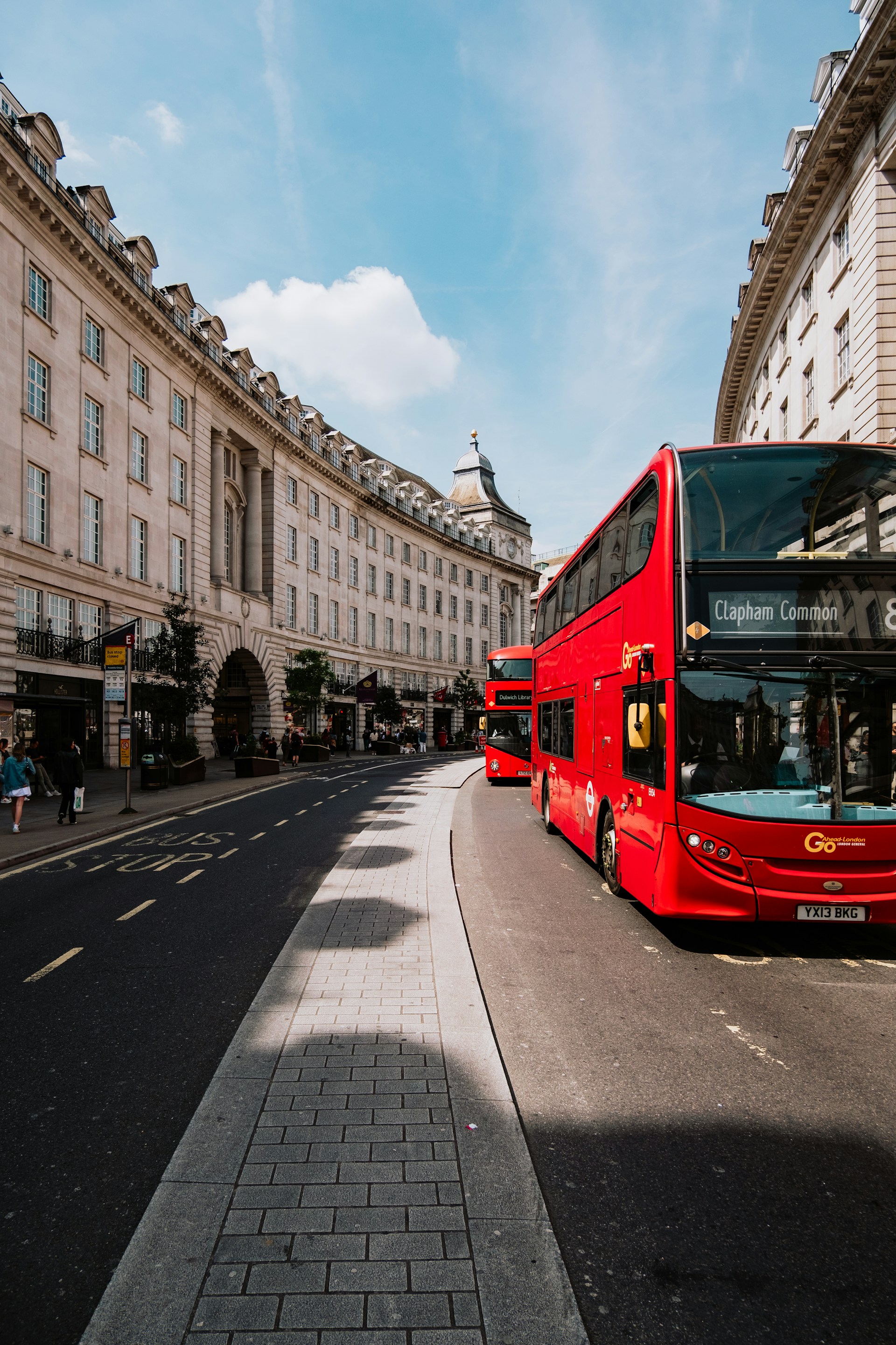 Iconic red double-decker bus driving through central London