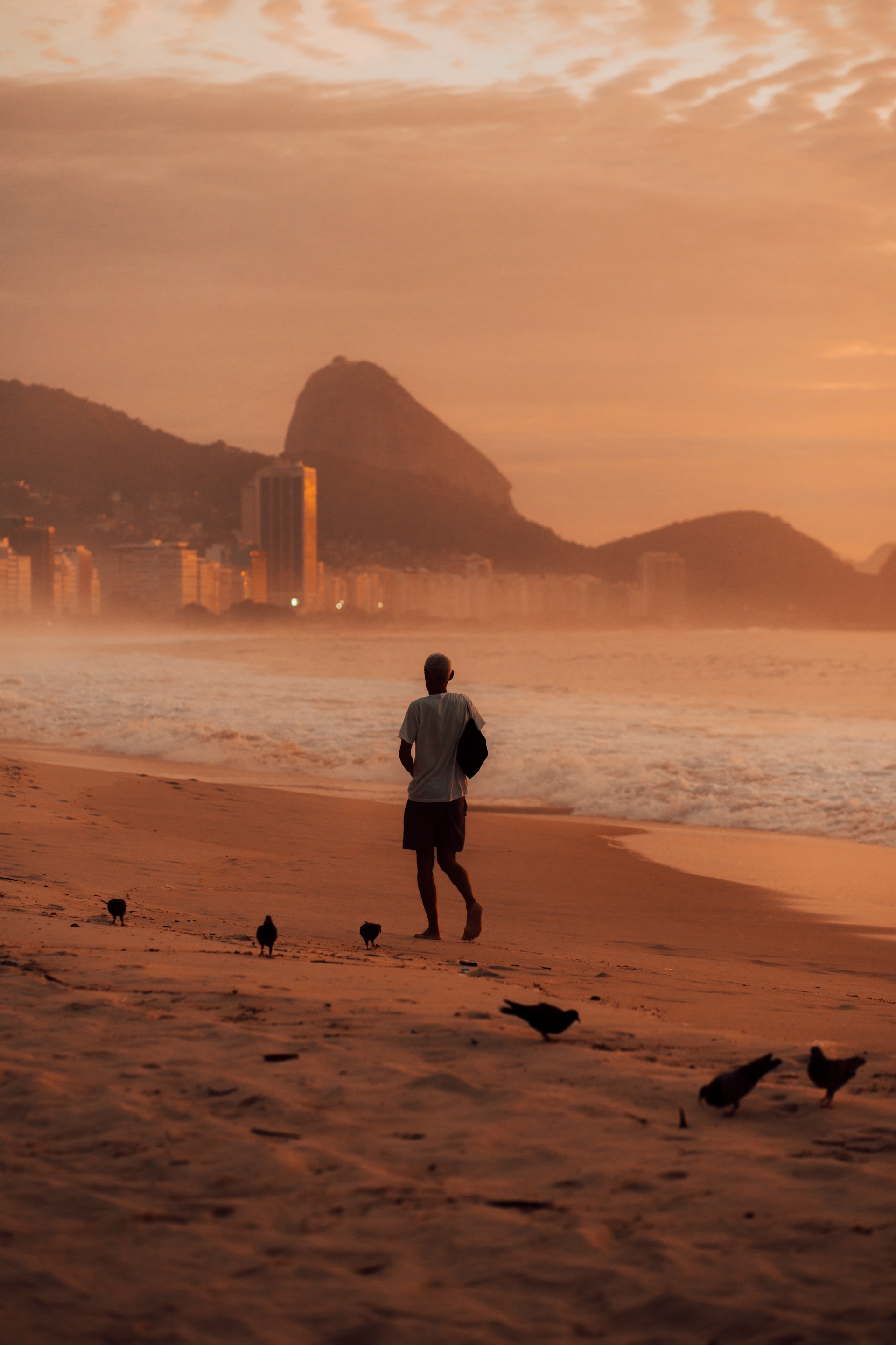 Warm orange sunset light over Rio de Janeiro skyline