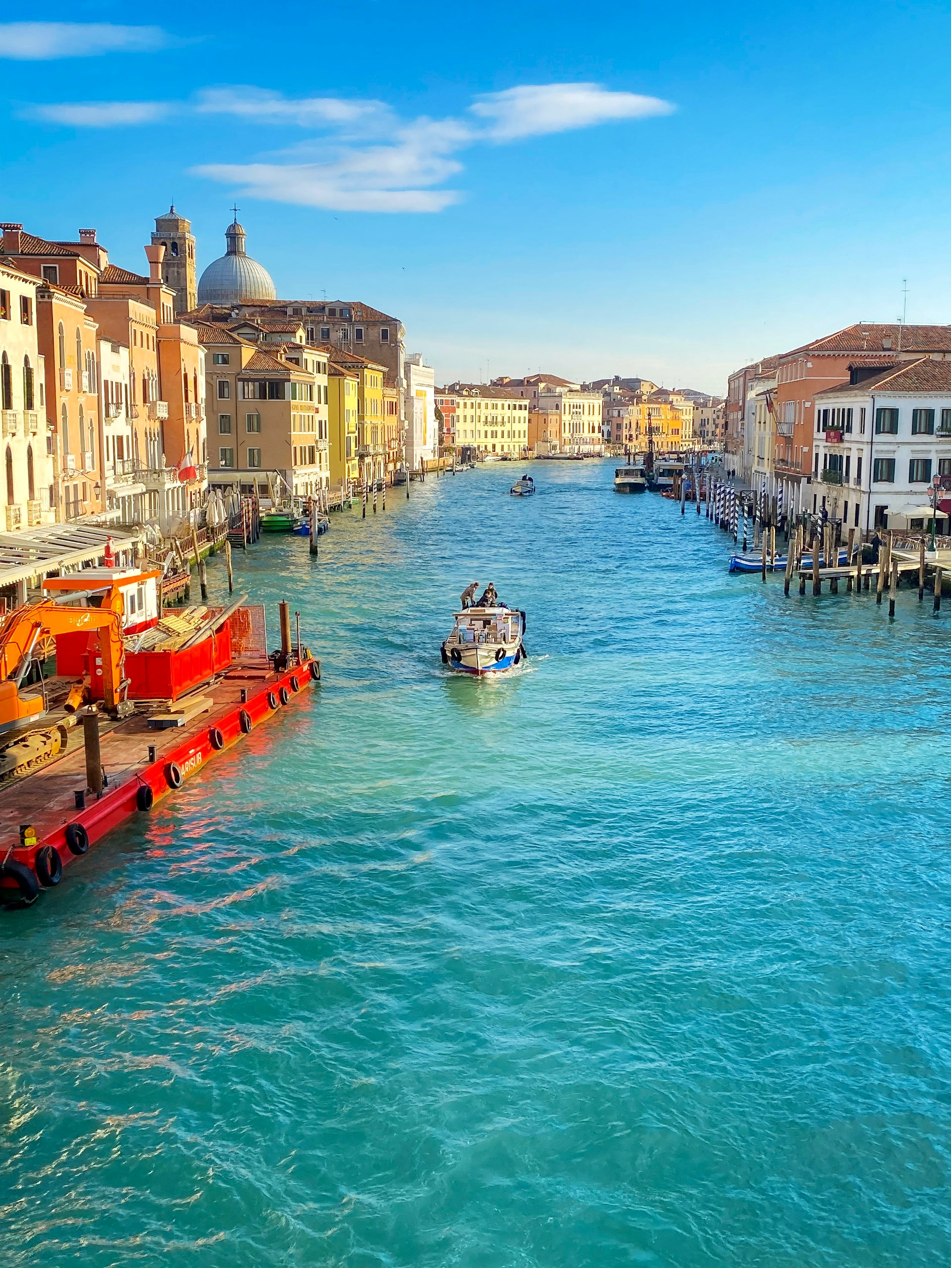 Clear blue water along the Grand Canal on a bright Venice afternoon