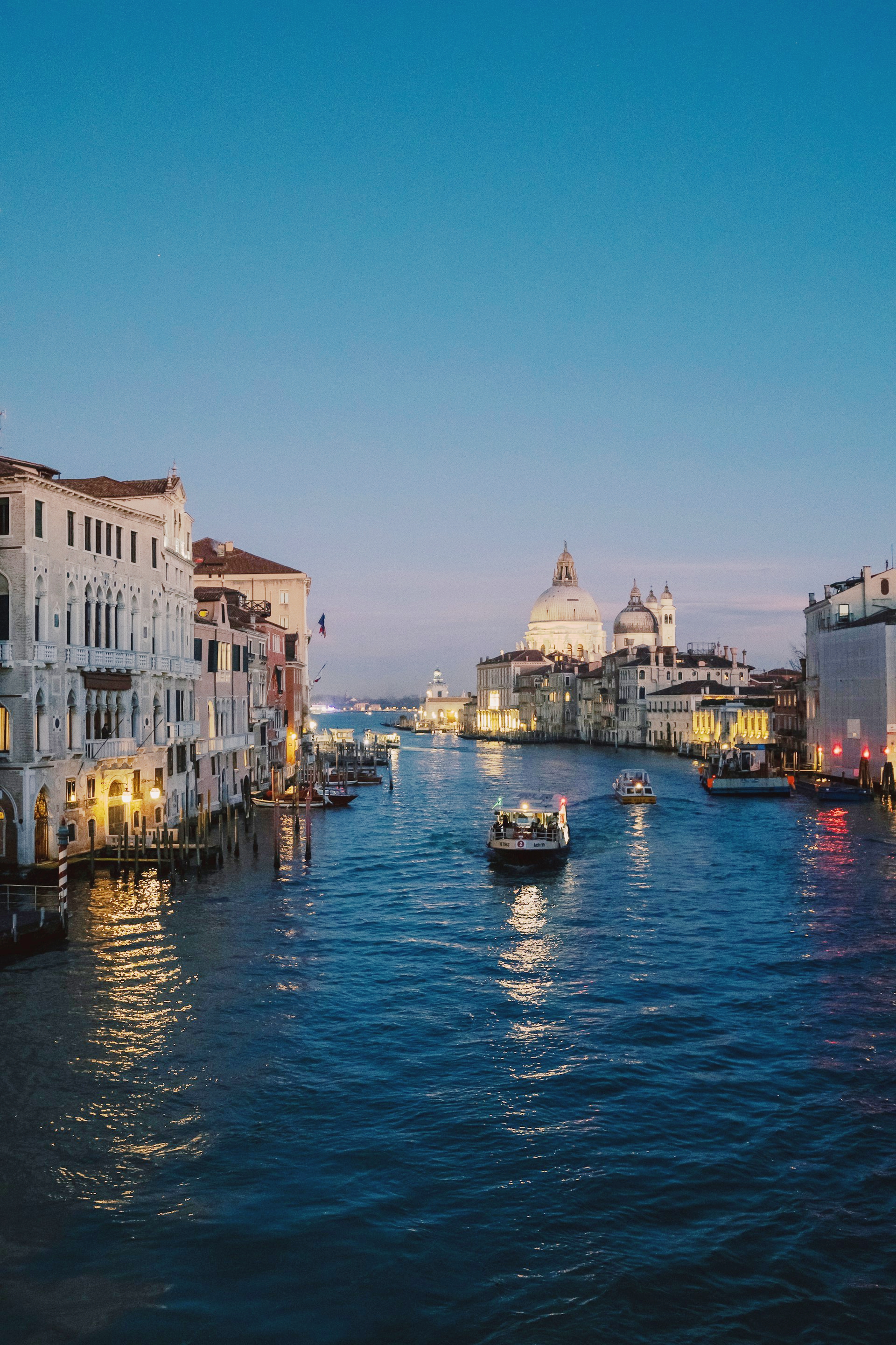Venice, Italy Boat traveling on water at night